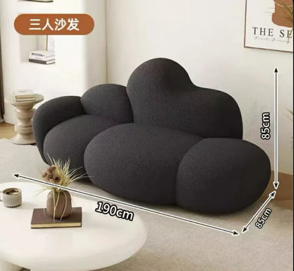 White MC THE BLACK DIAMOND sofa in a living room setting, showcasing a comfortable, relaxing lounge with plush cushions.