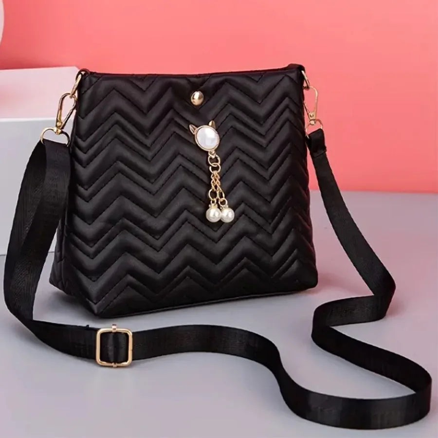 MC THE BLACK DIAMOND women's quilted crossbody bag with cat pearl pendant, stylish shoulder purse for holiday gifts.