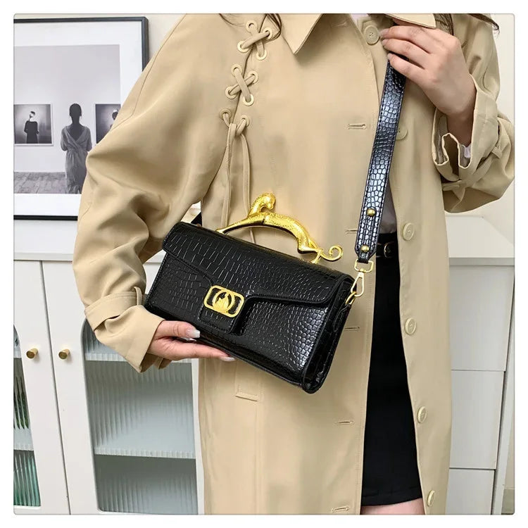 Women luxury leather hand bag by MC THE BLACK DIAMOND featuring a metal buckle and simple fashion design for stylish occasions.