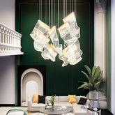 Modern MC THE BLACK DIAMOND LED chandelier hanging light fixture in a living and dining room setting with sleek design.