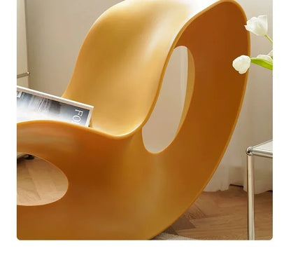 Modern MC THE BLACK DIAMOND rocking lounge chair made of rotational-molded PE plastic, stylish armchair for contemporary home decor.