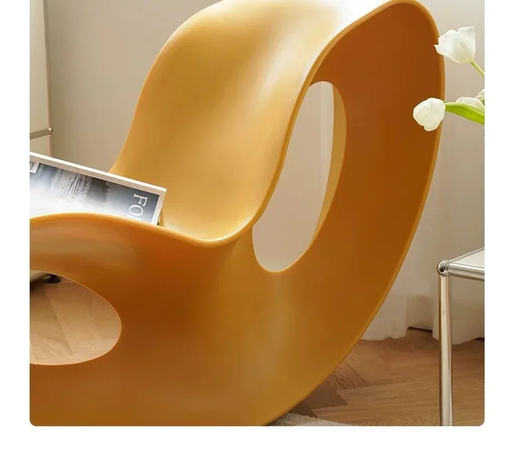 Modern MC THE BLACK DIAMOND rocking lounge chair made of rotational-molded PE plastic, stylish armchair for contemporary home decor.