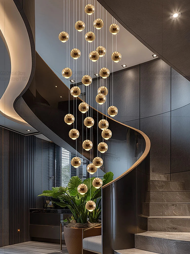 Modern MC THE BLACK DIAMOND LED staircase pendant light hanging in a living room with sleek design and warm illumination.