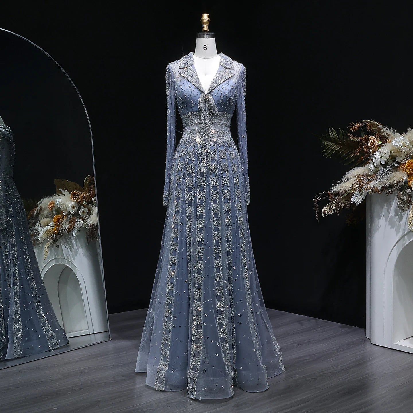 MC THE BLACK DIAMOND MC Long Sleeve Formal Evening Dress with V-neck, beaded embellishments, and elegant A-line silhouette.