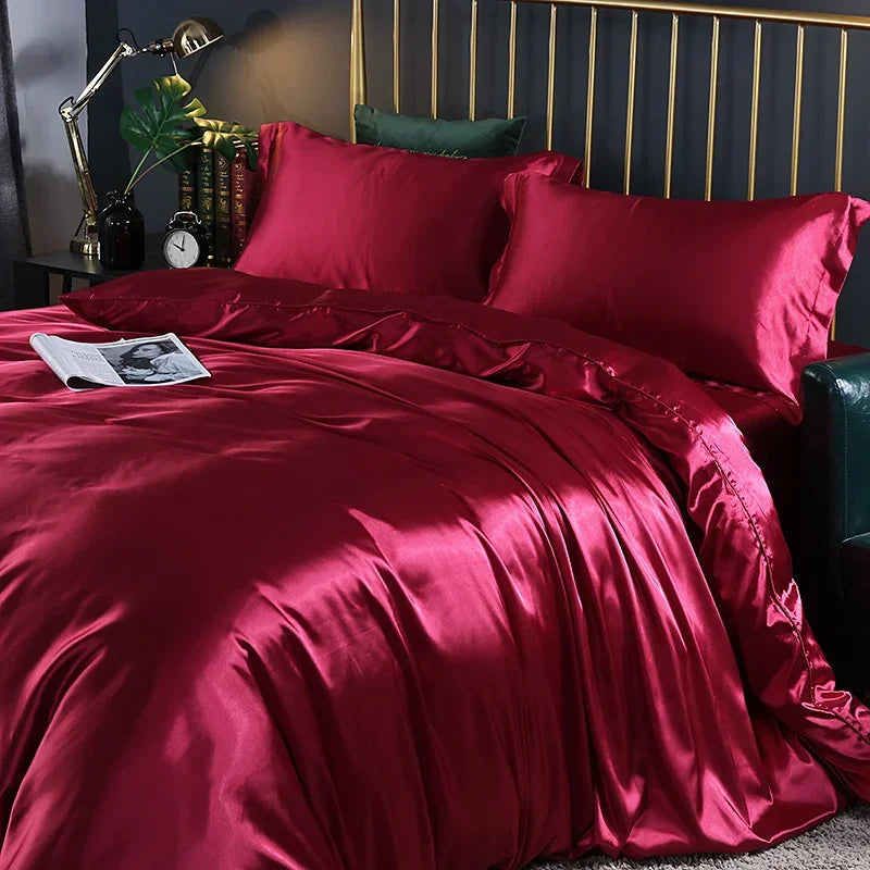 Luxury silk bedding set with duvet cover, fitted sheet, flat sheet, and pillowcases in solid color, King and Queen sizes.