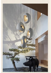 Nordic Villa Stairs Wabi Sabi E27 LED pendant lights by MC THE BLACK DIAMOND hanging along a staircase with warm ambient lighting