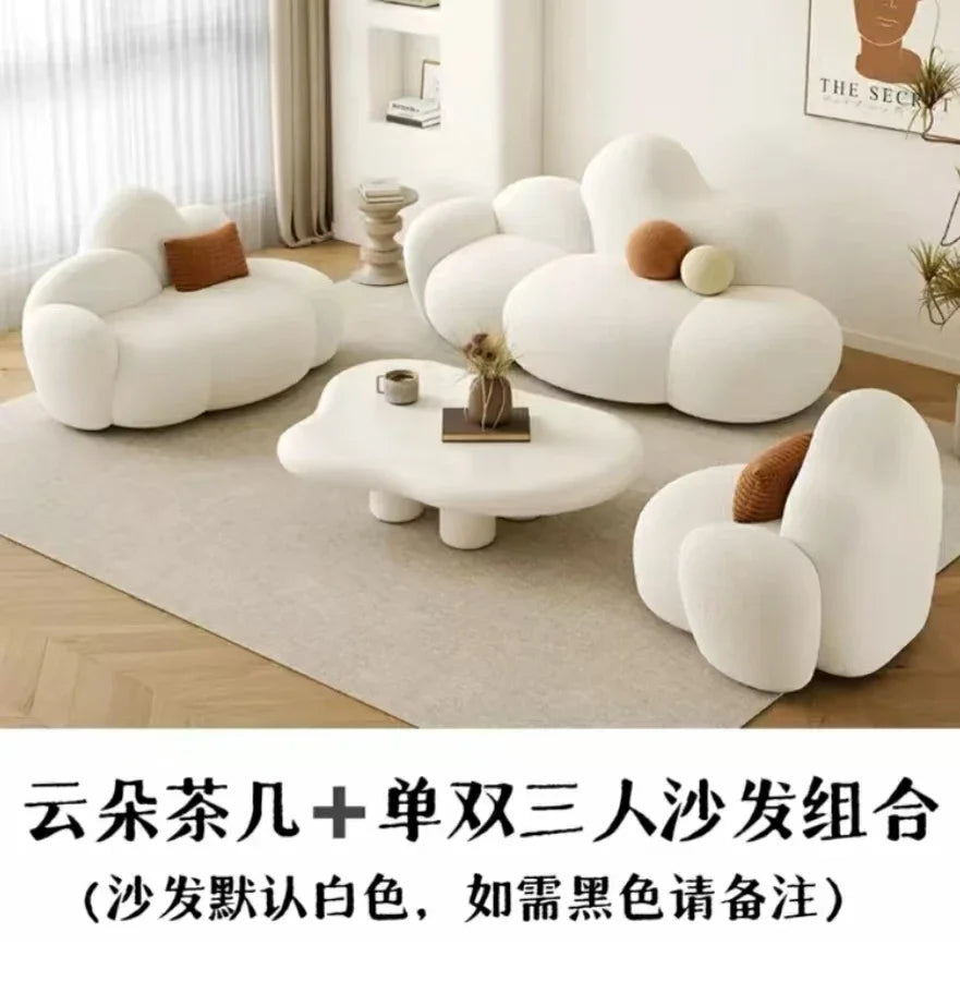 White MC THE BLACK DIAMOND sofa in a living room, featuring plush cushions and a comfortable lounge design.