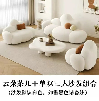 White MC THE BLACK DIAMOND sofa in a living room, featuring plush cushions and a comfortable lounge design.