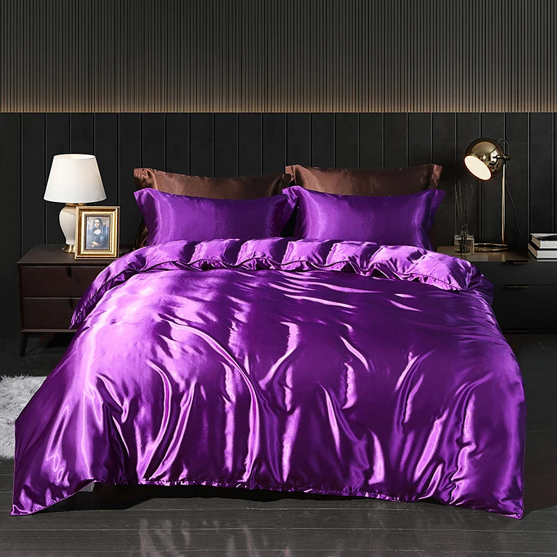 Luxury satin bedding set with fitted sheet and duvet cover by MC THE BLACK DIAMOND, showcasing smooth, shiny fabric in elegant home decor style.