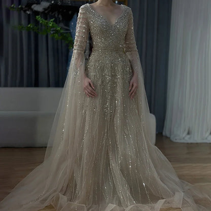 MC THE BLACK DIAMOND Arabic caramel A-line evening dress featuring beaded embellishments and flowing fabric for elegant occasions.