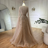 Elegant black A-line evening dress by MC THE BLACK DIAMOND with intricate beading and Arabic caramel accents.