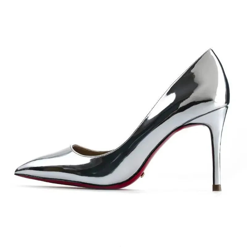 Plus size red women’s pumps with pointed toes, rubber soles, and high heels, perfect for dressy parties and weddings.