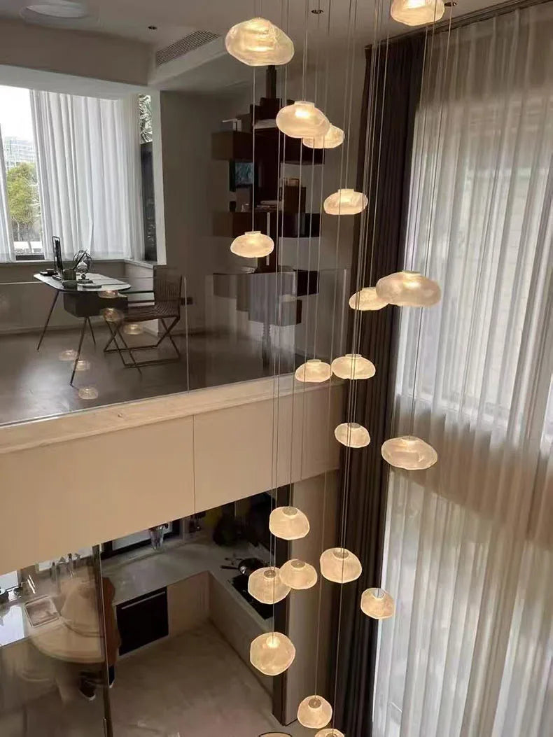 MC THE BLACK DIAMOND Nordic stair chandelier pendant light in living room or bedroom decor, featuring modern design and warm lighting
