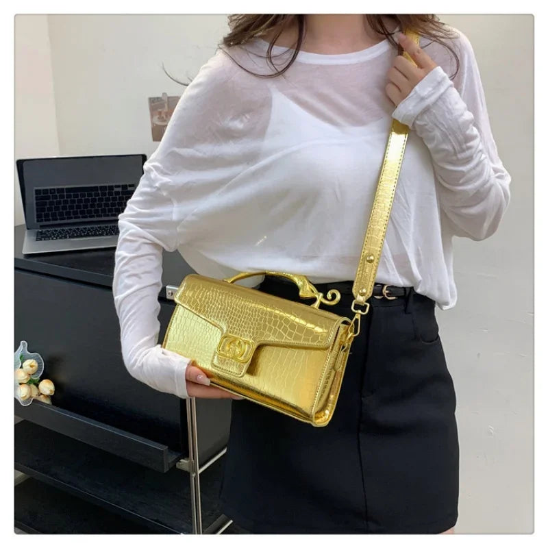 Women’s luxury leather shoulder bag by MC THE BLACK DIAMOND featuring a metal buckle and simple fashion design, ideal for parties.