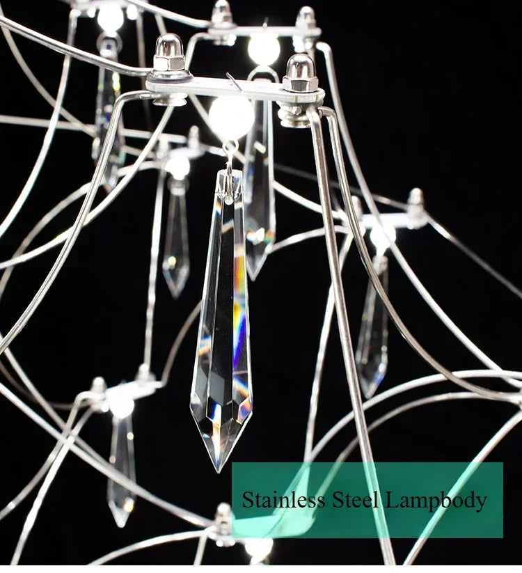Modern chrome-plating luxury crystal chandelier by MC THE BLACK DIAMOND, featuring intricate hanging crystals and elegant lighting design.