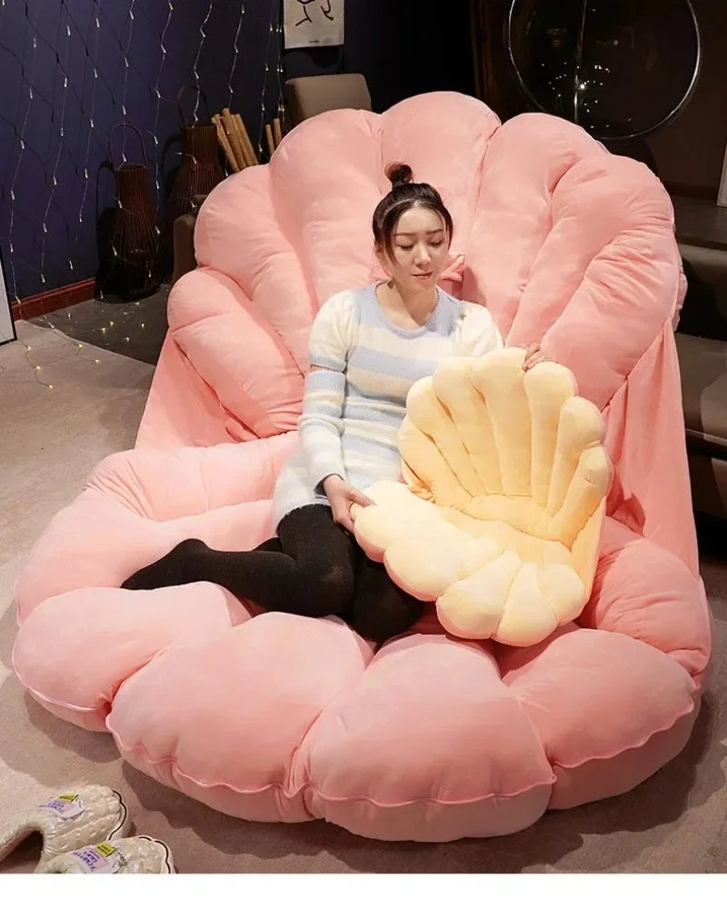 Giant seashell-shaped plush pillow from MC THE BLACK DIAMOND, perfect as a large clam shell cushion for kids' beds or sofas.