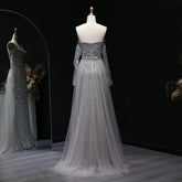 Beaded grey Arabic evening dress by MC THE BLACK DIAMOND featuring intricate embroidery and elegant design.