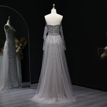 Beaded grey Arabic evening dress by MC THE BLACK DIAMOND featuring intricate embroidery and elegant design.