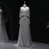 MC Gorgeous Beaded Grey Arabic Evening Dress by MC THE BLACK DIAMOND featuring intricate beadwork and elegant flowing fabric.