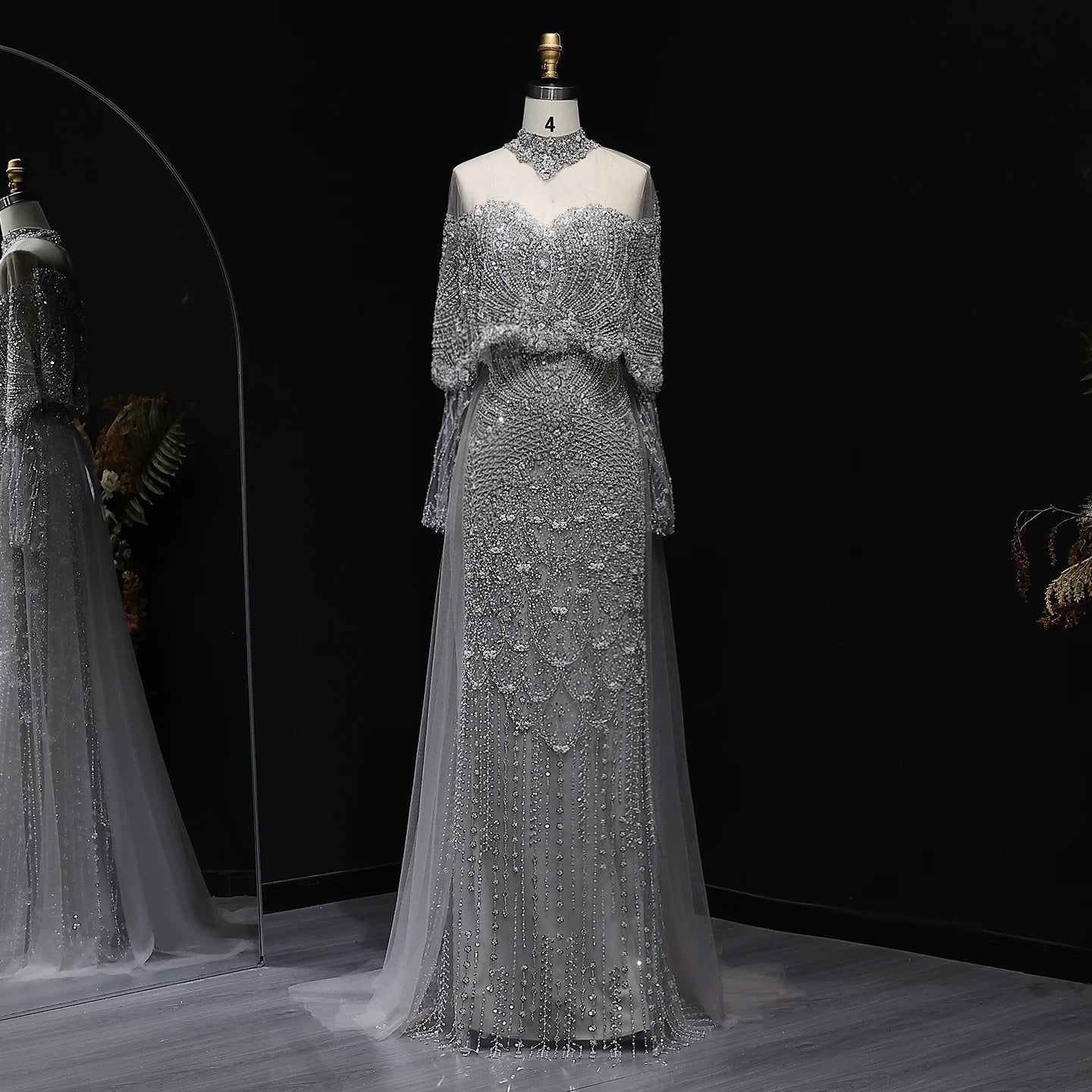 MC Gorgeous Beaded Grey Arabic Evening Dress by MC THE BLACK DIAMOND featuring intricate beadwork and elegant flowing fabric.