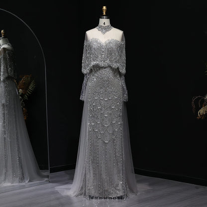 MC Gorgeous Beaded Grey Arabic Evening Dress by MC THE BLACK DIAMOND featuring intricate beadwork and elegant flowing fabric.