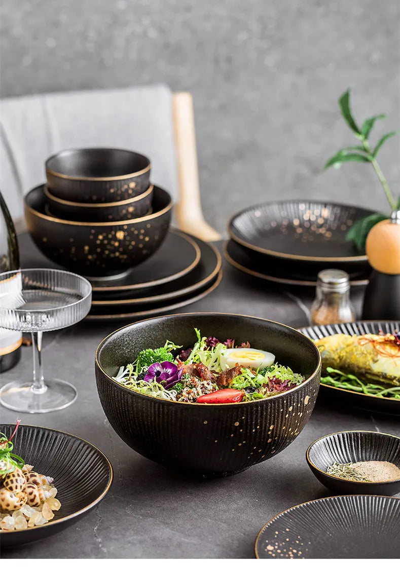 Black porcelain dinner plates with gilt rims from 𝕄𝕔 𝕋𝕙𝕖 𝔹𝕝𝕒𝕔𝕜 𝔻𝕚𝕒𝕞𝕠𝕟