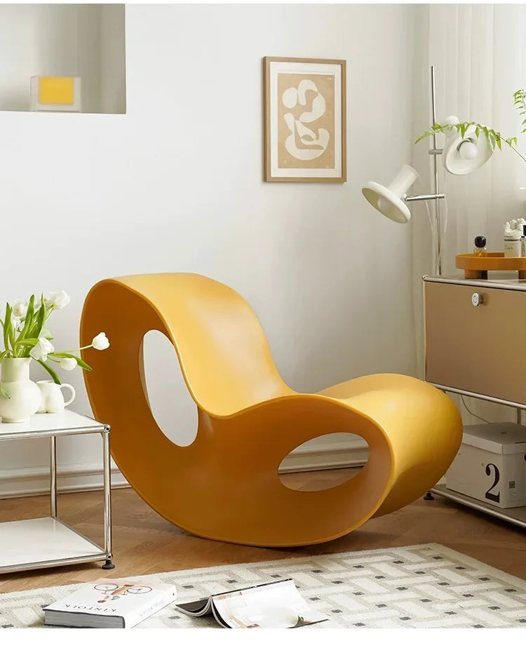 Modern MC THE BLACK DIAMOND rocking lounge chair made of PE plastic, with a smooth, curved design for relaxed seating.