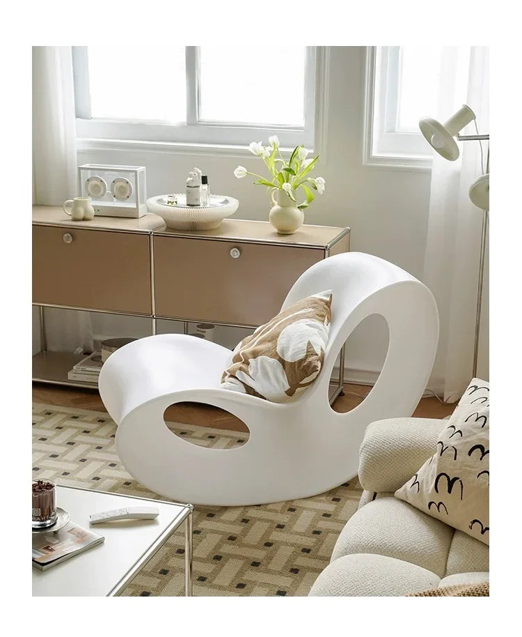 Modern MC THE BLACK DIAMOND rocking lounge armchair in colorful rotational-molded polyethylene, ideal for contemporary home decor.