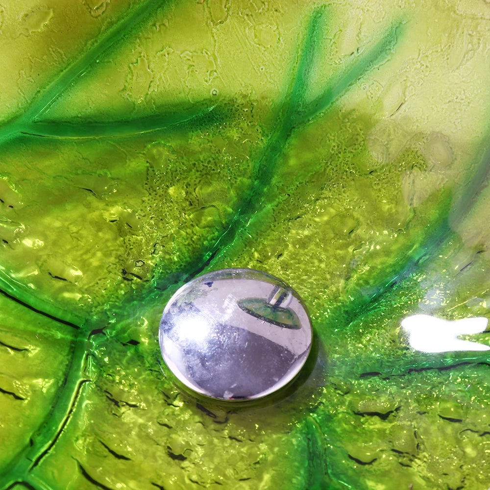 Green leaf-shaped vessel sink by MC THE BLACK DIAMOND, modern bathroom wash basin with natural leaf design.