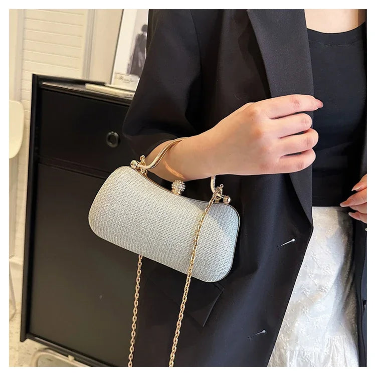 Black chain evening shoulder bag by MC THE BLACK DIAMOND, stylish hand bag for women suitable for dinner and formal occasions.