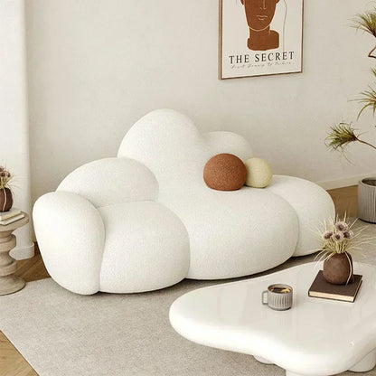 White MC THE BLACK DIAMOND sofa in a living room, showcasing a comfortable, relaxing lounge sofa with soft cushions and stylish design.