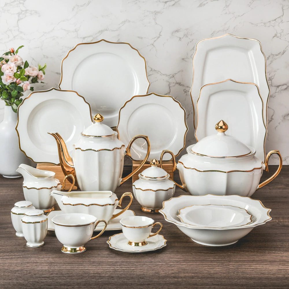 Elegant porcelain dinnerware set by MC THE BLACK DIAMOND, featuring plates, bowls, and cups for luxurious table setting.