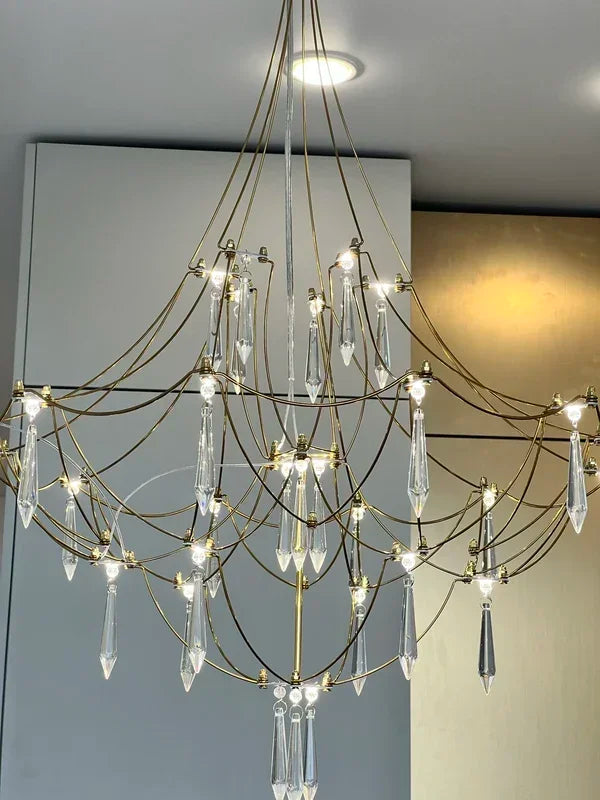Modern chrome-plated luxury crystal chandelier by MC THE BLACK DIAMOND, featuring elegant hanging crystal details for living room lighting.