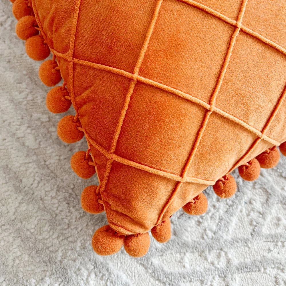 Yellow-orange velvet lumbar pillow cover with diamond stripes, pompom tassels, suitable for 30x50cm or 45x45cm home decor.
