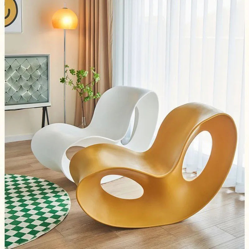Modern MC THE BLACK DIAMOND rocking lounge armchair made of colorful polyethylene, with a curved, ergonomic design for relaxation.
