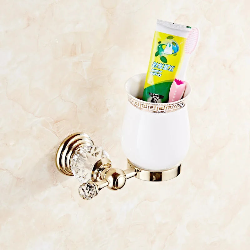 Luxury gold polished brass bathroom accessories set with wall-mounted crystal bath hardware, featuring soap dish, towel holder, and more.