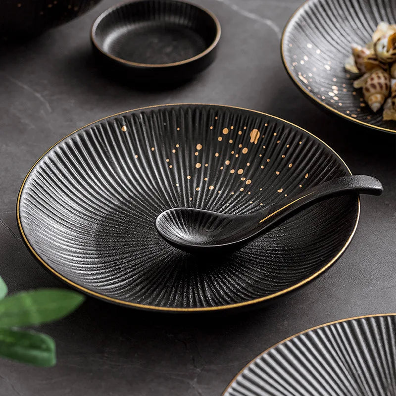 Black porcelain dinner plates with gilt rims, part of the 𝕄𝕔 𝕋𝕙𝕖 𝔹𝕝𝕒𝕔𝕜 𝔻𝕚𝕒𝕞𝕠