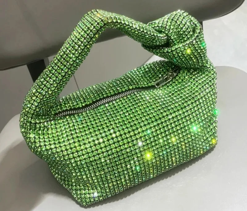 Silver crystal handle evening bag with rhinestone knot design by MC THE BLACK DIAMOND, featuring a top handle and luxury tote style.