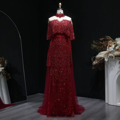 Beaded grey Arabic evening dress by MC THE BLACK DIAMOND featuring intricate beadwork and elegant design.