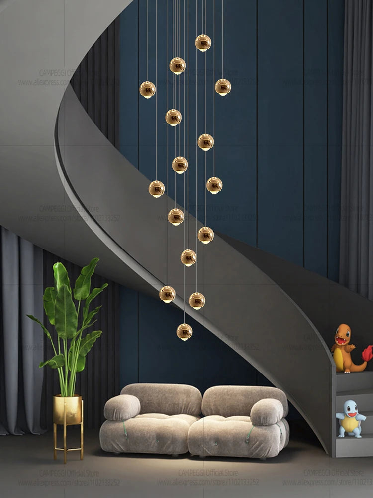 Modern MC THE BLACK DIAMOND LED staircase pendant light hanging in a living room, showcasing sleek design and warm illumination.