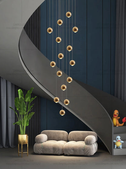 Modern MC THE BLACK DIAMOND LED staircase pendant light hanging in a living room, showcasing sleek design and warm illumination.