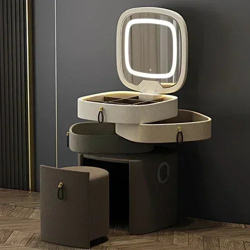 Modern makeup vanity with storage drawer, luxury mirror, and stool by MC THE BLACK DIAMOND, featuring sleek design and reflective surface.