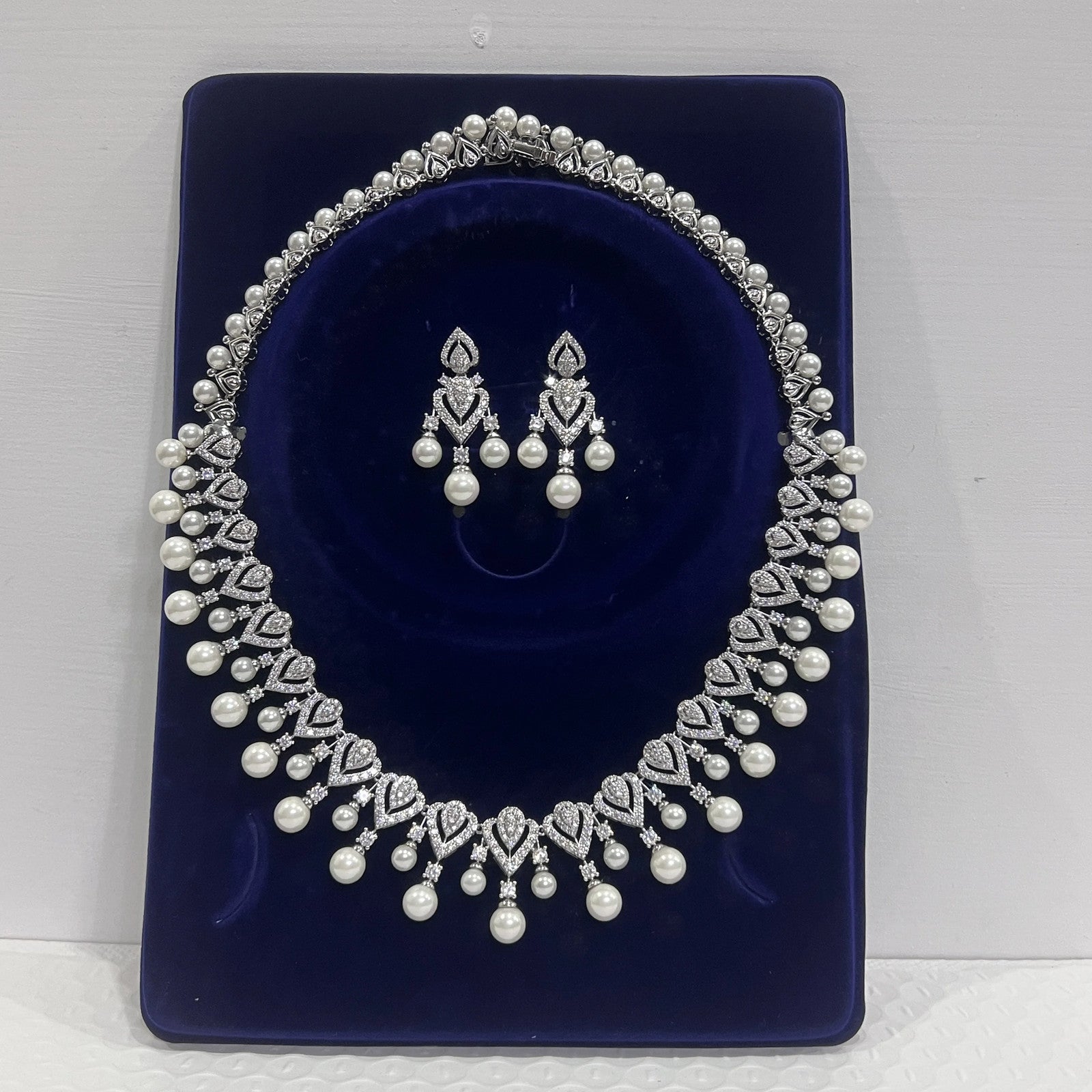 Elegant pearl necklace for women, showcasing a string of lustrous white pearls on a delicate jewelry chain.
