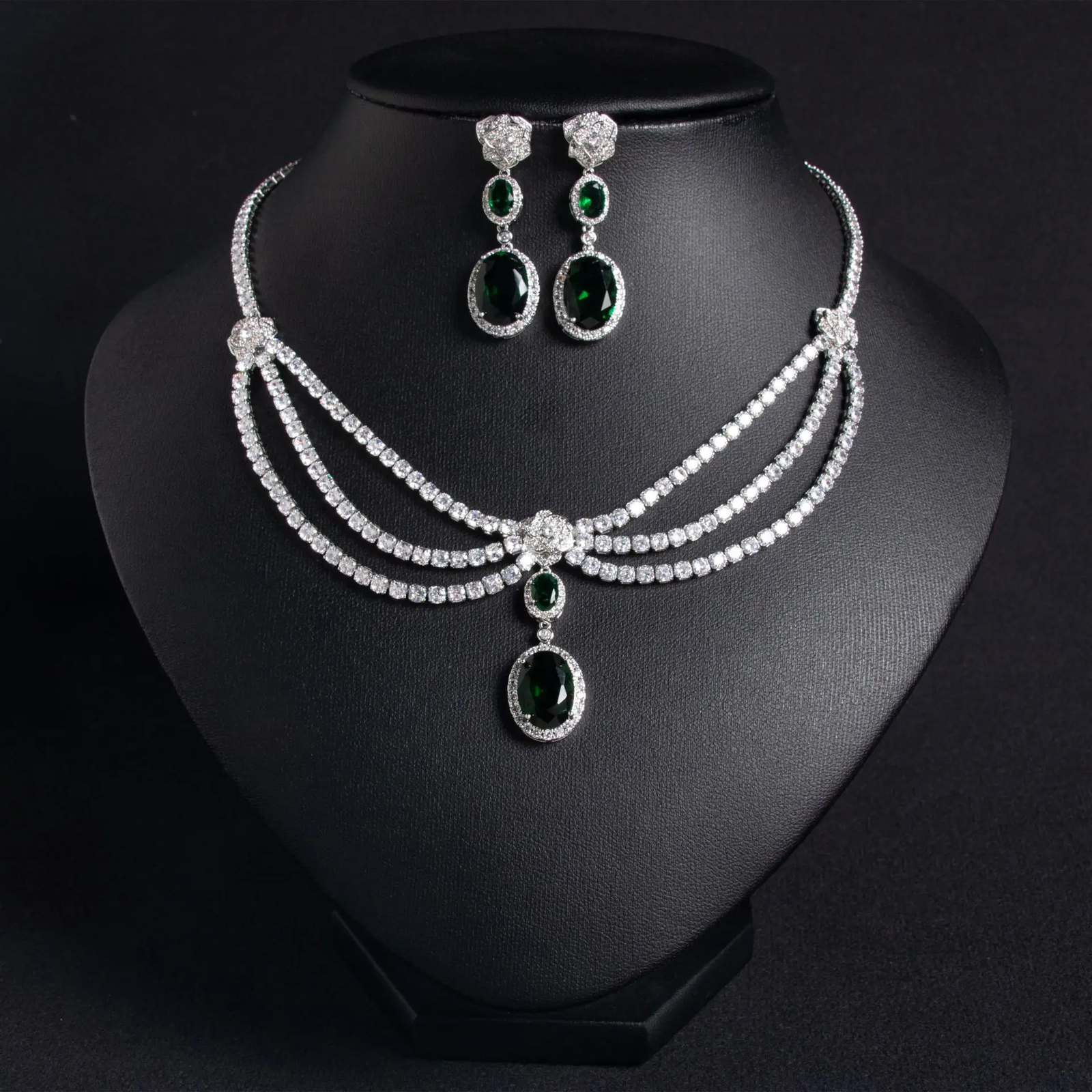 Elegant women's jewelry set with zircon flower tassel necklace and matching earrings, featuring green accents.