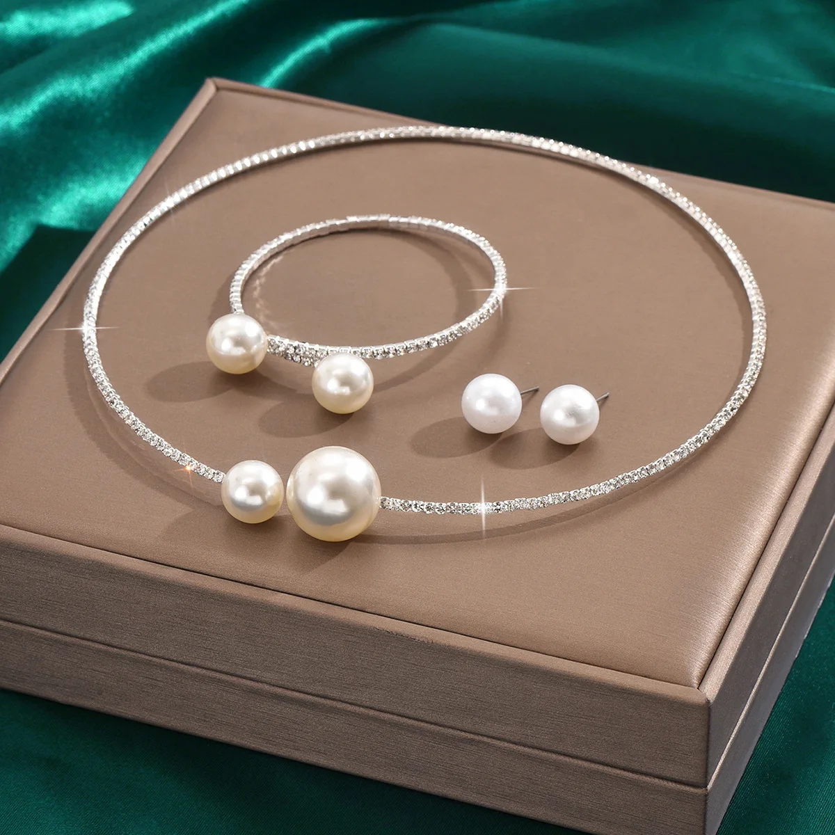 Mohammad Collection full crystal jewelry set with pearl necklace, bracelet, and earrings featuring minimalist design and elegant embellishments.